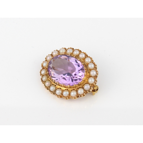 247 - A 9ct gold, amethyst and seed pearl brooch - hallmarked London 1964, 27mm long.