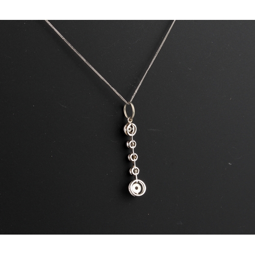 228 - An Edwardian style 9ct white gold and diamond five stone drop pendant - with two halo set brilliant ... 