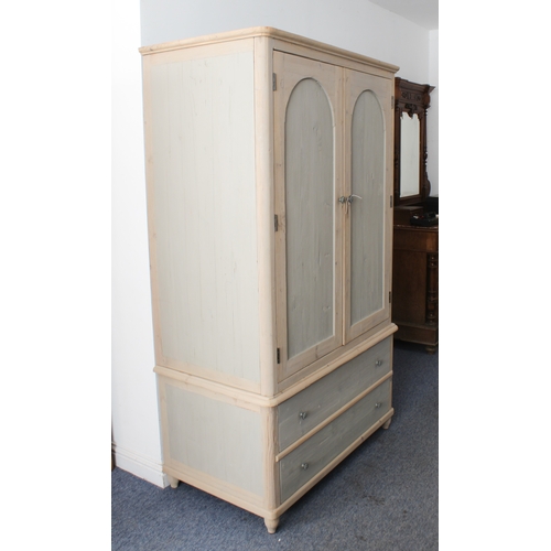 407 - A 19th century style painted pine linen press - the shallow moulded top over a pair of arched panell... 