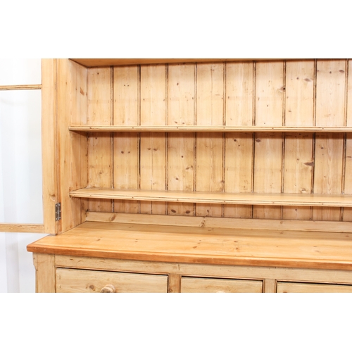 464 - A Victorian and later waxed pine glazed dresser - the moulded cornice over a pair of four-pane glaze... 