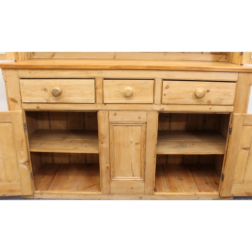 464 - A Victorian and later waxed pine glazed dresser - the moulded cornice over a pair of four-pane glaze... 