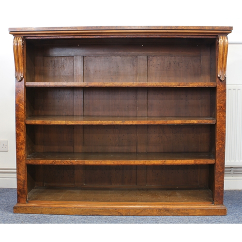 482 - A mid-19th century burr walnut open bookcase - the well figured top on boldly carved foliate bracket... 