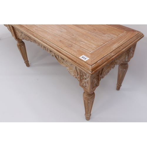 513 - An Oriental carved, limed hardwood long stool or bench - modern, the cleated, moulded seat over a fo... 