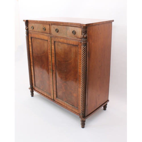 474 - A Regency mahogany chiffonier - the rectangular top with outset front angles, on foliate carved and ... 