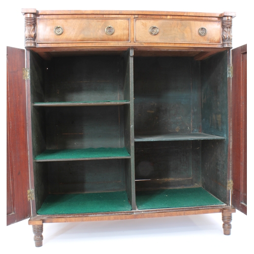 474 - A Regency mahogany chiffonier - the rectangular top with outset front angles, on foliate carved and ... 