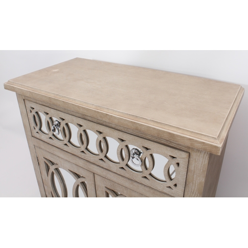 509 - A pair of limed oak side cabinets in the Art Deco taste - modern, the cavetto moulded tops over a si... 