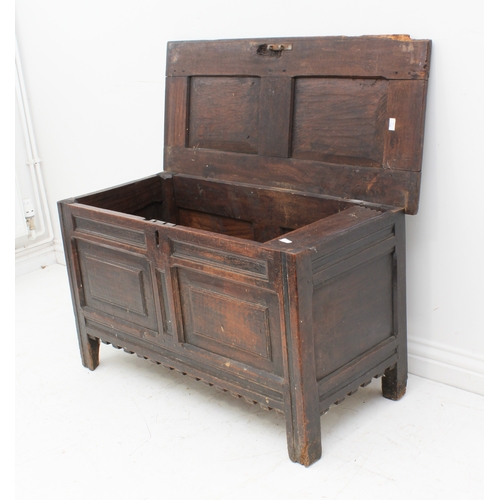 527 - An early 18th century joined oak two-panel coffer - the moulded, two-panel lid on the original ring ... 