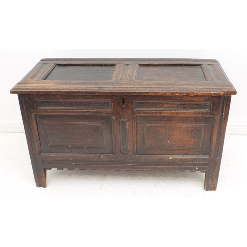 527 - An early 18th century joined oak two-panel coffer - the moulded, two-panel lid on the original ring ... 