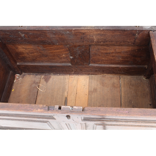 527 - An early 18th century joined oak two-panel coffer - the moulded, two-panel lid on the original ring ... 