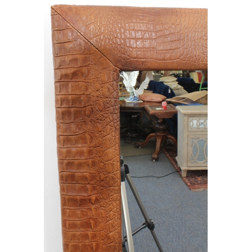 538 - A rectangular crocodile leather mirror - 91 x 60.5 cm.