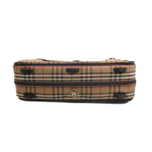 577 - A vintage Burberry suit carrier case - 1980s, in classic check with dark brown leather trim and gold... 