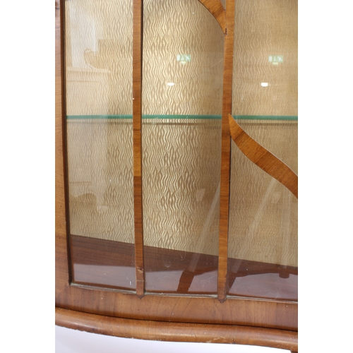 528 - An Art Deco period serpentine walnut display cabinet - raised on cabriole legs (LWH 96.5 x 34 x 106 ... 