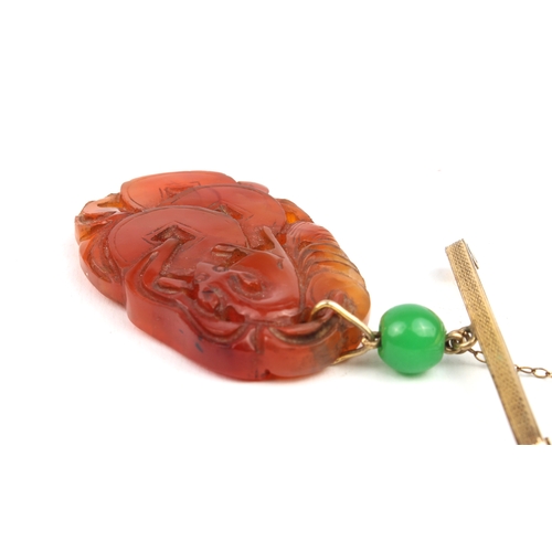 230 - A mid-century Chinese carved jade plaque on bar brooch - the ovoid, russet jade plaque pierced and c... 