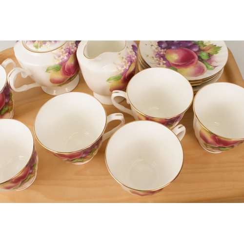 46 - A Kirsty Jane China bone china tea service - comprising six tea cups and saucers, teapot, milk jug a... 