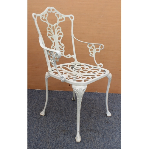 539 - A white-painted cast metal circular garden table and four chairs - the table with pierced leafy scro... 