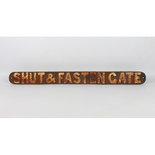 700 - A cast iron 'Shut & Fasten Gate' railway sign - painted black with white lettering, 80.5 cm long.