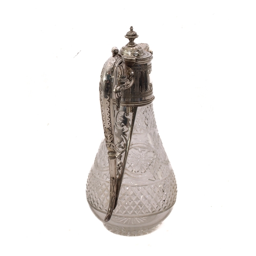 121 - A cut glass claret jug with silver plated mounts - c.1900, the glass body with diamond and floral ov... 