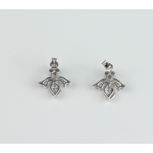 170 - A pair of 18ct white gold and diamonds earrings - unmarked, tests as 18ct gold, in the form of inver... 