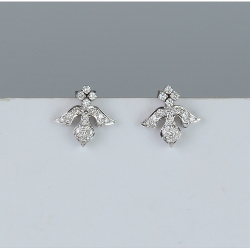 170 - A pair of 18ct white gold and diamonds earrings - unmarked, tests as 18ct gold, in the form of inver... 