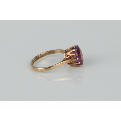 175 - Two 9ct yellow gold and amethyst rings - one with an oval cut single stone, size J; the other with a... 