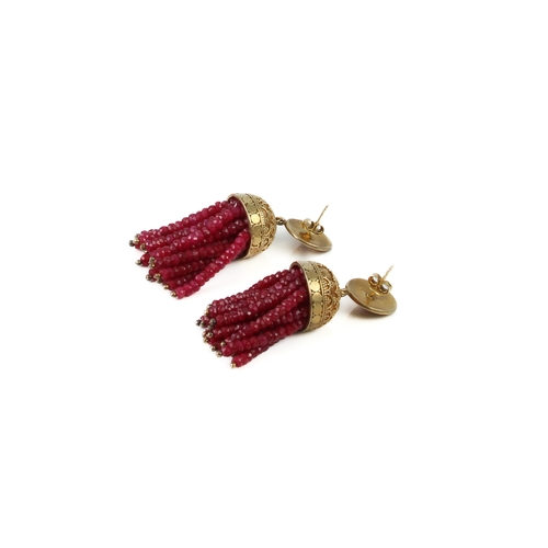 182 - A pair of silver gilt and ruby drop earrings - probably Indian, the tassel form drop with strings of... 