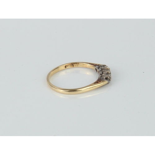 189 - An 18ct gold and diamond ring - three stones missing.