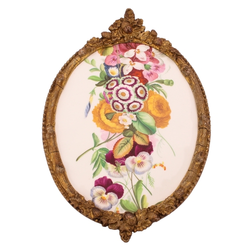 29 - A 19th century painted porcelain plaque - oval, painted with a bold spray of Spring garden flowers, ... 