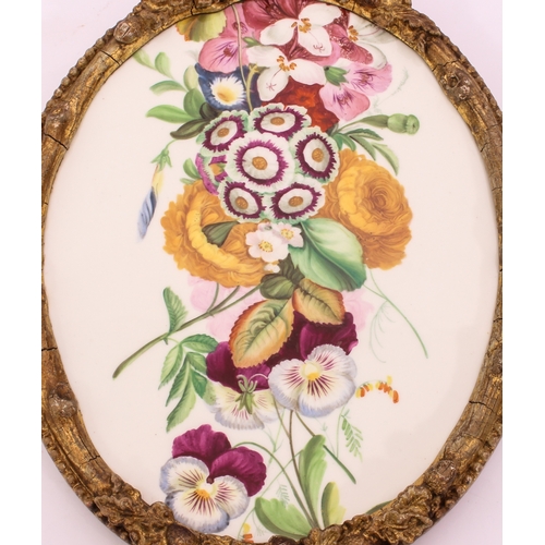 29 - A 19th century painted porcelain plaque - oval, painted with a bold spray of Spring garden flowers, ... 