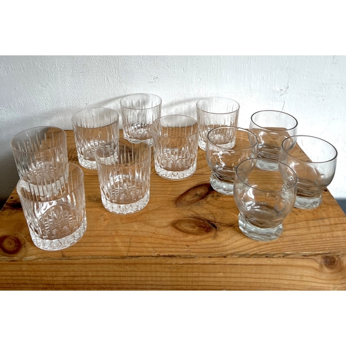 44 - A set of seven cut glass whisky tumblers, third quarter 20th century - with slice and comb cut decor... 