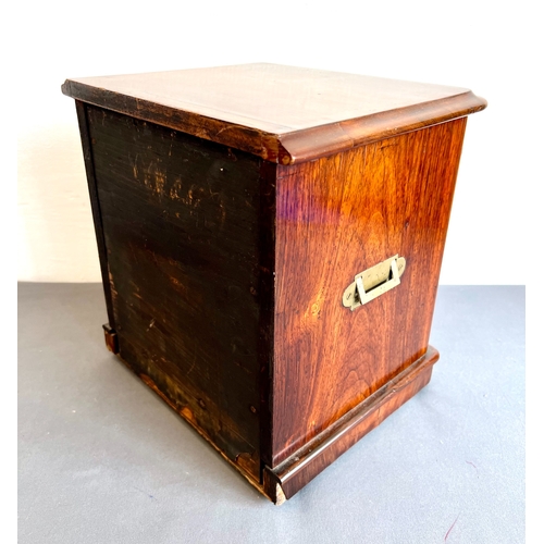 721 - A late 19th / early 20th century rosewood table cabinet - the moulded top over two cross banded, pan... 