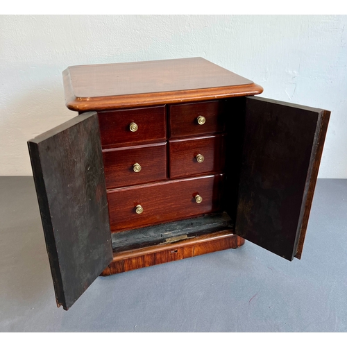 721 - A late 19th / early 20th century rosewood table cabinet - the moulded top over two cross banded, pan... 