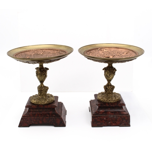 724 - A pair of gilt metal, copper and marble tazzas - late 19th / early 20th century, in the style of Cel... 