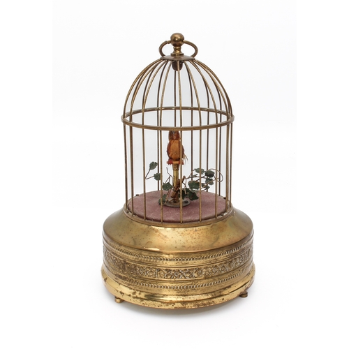 726 - A German singing bird automaton, early 20th century - the bird perched on a leafy wire branch, in a ... 