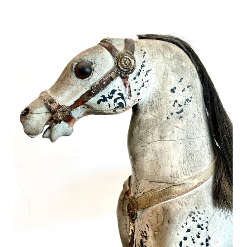 736 - An English 19th century carved and painted wooden horse - probably originally mounted on wheels, the... 