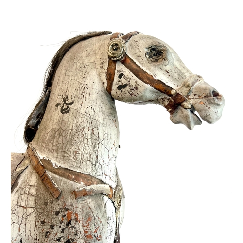 736 - An English 19th century carved and painted wooden horse - probably originally mounted on wheels, the... 