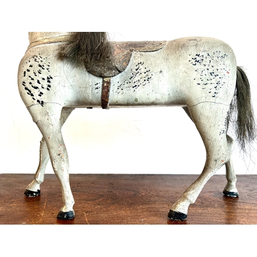 736 - An English 19th century carved and painted wooden horse - probably originally mounted on wheels, the... 