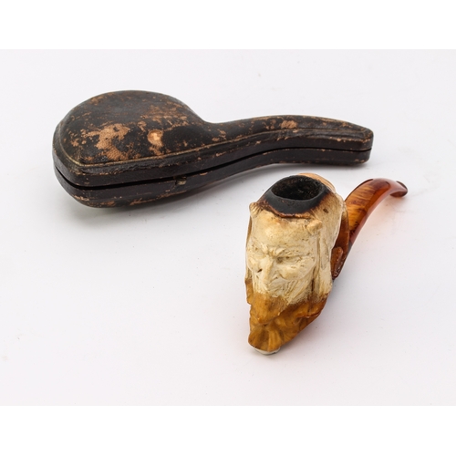 750 - A small group of cased pipes, cigarette holders and a snuff box - comprising a cased Meerschaum pipe... 