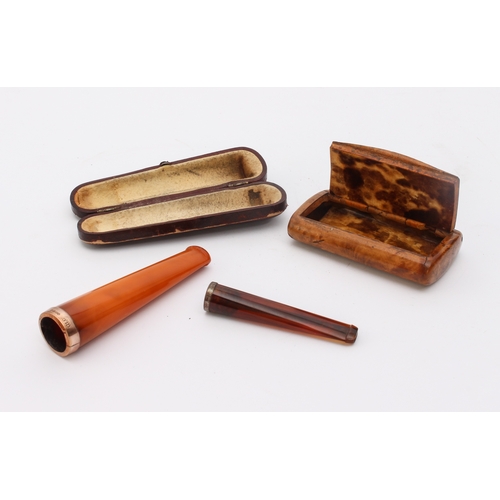 750 - A small group of cased pipes, cigarette holders and a snuff box - comprising a cased Meerschaum pipe... 