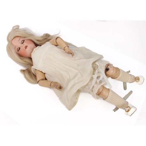 771 - A Heubach Koppelsdorf 250 bisque head girl doll - circa 1910, with weighted brown glass eyes, real u... 