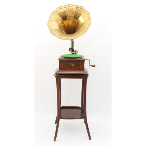 779 - A reproduction HMV oak-cased horn gramophone - fitted with a No.54 soundbox, with winding handle and... 