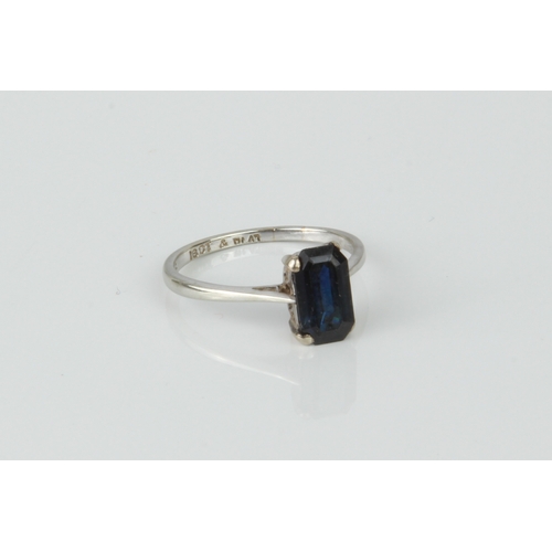 190 - An 18ct white gold, platinum and sapphire single stone ring - the 9 x 5mm emerald cut sapphire, appr... 