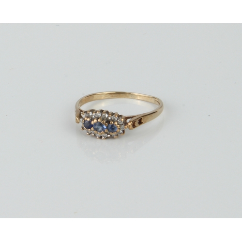 197 - A 9ct yellow gold, sapphire and diamond cluster ring - British hallmarked, the three graduated round... 