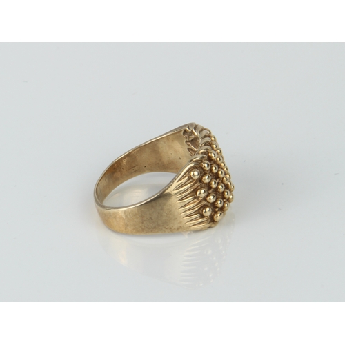 198 - A vintage 9ct yellow gold ring - marked 375, with beaded decoration over fluted shoulders, size T.