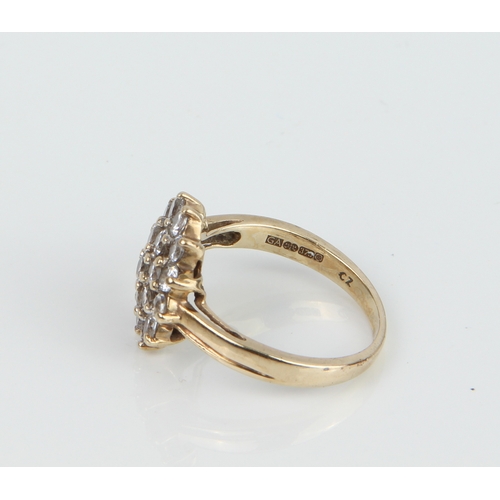 202 - A 9ct gold and CZ cluster ring - Sheffield hallmarked, size N.