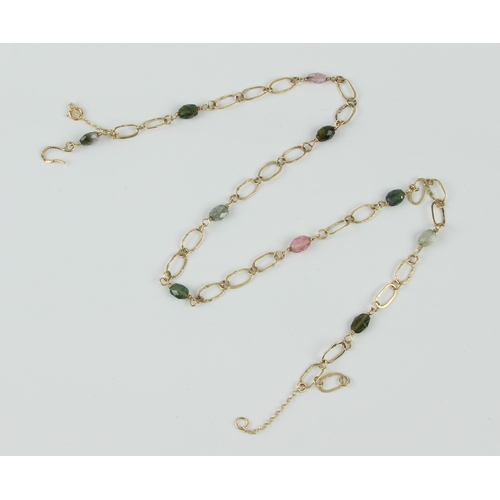 204 - An 18ct yellow gold and multi gem necklace - the large cable links finished with a bark effect to on... 