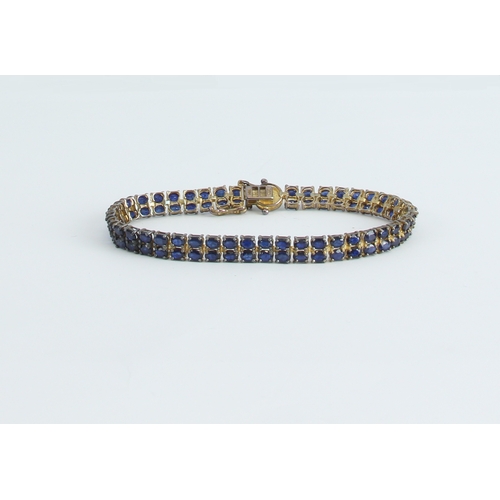 207 - Three silver gem set bracelets - comprising a two row bracelet set with oval synthetic sapphires, 20... 