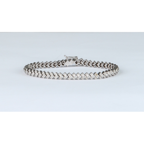 210 - A vintage 18ct white gold and diamond flexible bracelet - stamped '750', the chevron shaped box link... 