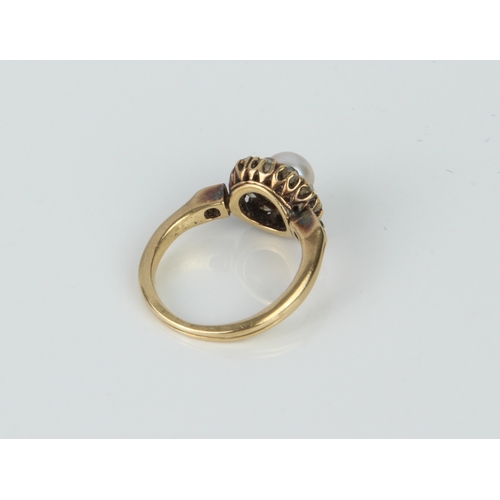 219 - An Edwardian / 1920s 18ct yellow gold, pearl and diamond cluster ring - unmarked, tests as 18ct, the... 