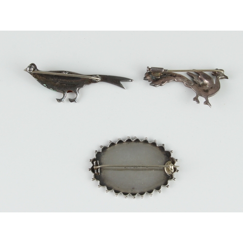 221 - Three vintage silver brooches - two in the form of birds, including an enamel and marcasite pheasant... 