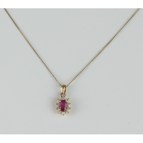 230 - A 9ct yellow gold, pink topaz and diamond cluster pendant - marked 9CT 375, the oval cut pink topaz ... 